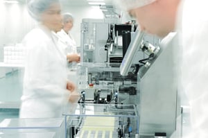 Workers in motion at modern drug factory-1